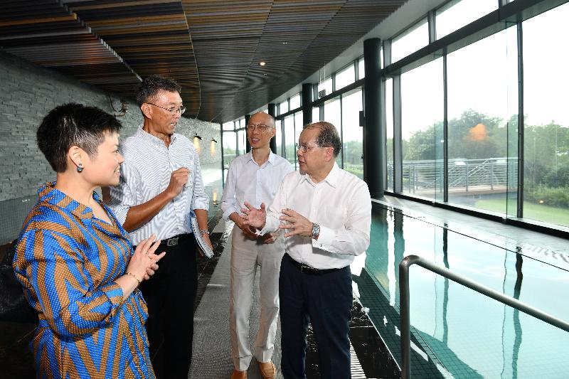 The Chief Secretary for Administration, Mr Matthew Cheung Kin-chung (first right), accompanied by the Secretary for the Environment, Mr Wong Kam-sing (second right), visits T·PARK today (May 15) to better understand how T·SPA pools are supported by the heat energy recovered from the sludge incineration process.