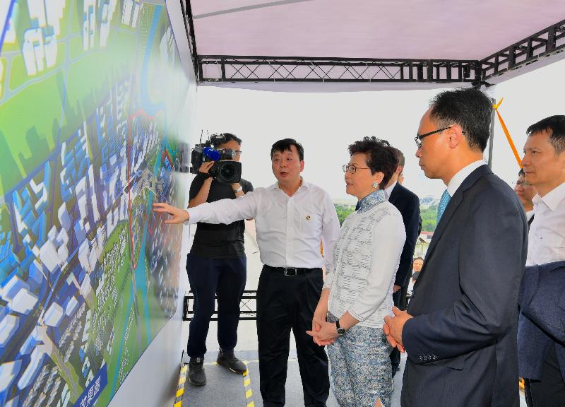The Chief Executive, Mrs Carrie Lam, visited Haiyi Bridge in Foshan today (May 16). Photo shows Mrs Lam (front row, centre) receiving a briefing from the Mayor of the Foshan Municipal Government, Mr Zhu Wei (front row, left), on the infrastructure development in the area. The Secretary for Constitutional and Mainland Affairs, Mr Patrick Nip (front row, right), was also present.