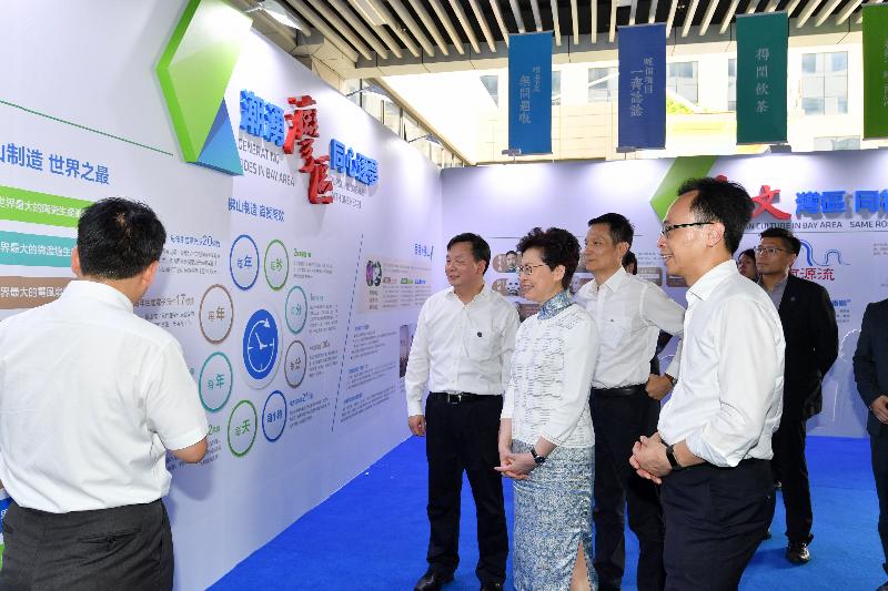 The Chief Executive, Mrs Carrie Lam, visited the Guangdong-Hong Kong-Macao Technology Exhibition and Exchange Center of Gungho Space in Foshan today (May 16). Photo shows Mrs Lam (third left), accompanied by the Secretary for Constitutional and Mainland Affairs, Mr Patrick Nip (first right); the Mayor of the Foshan Municipal Government, Mr Zhu Wei (second left); and the Director General of the Hong Kong and Macao Affairs Office of the People's Government of Guangdong Province, Mr Liao Jingshan (fourth left), receiving briefing on the history and latest developments of Foshan.