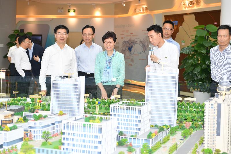 The Chief Executive, Mrs Carrie Lam, visited the Hong Kong-Macao Youth Innovation and Entrepreneurial Base in Tus-City, Zhaoqing New District today (May 17). Photo shows Mrs Lam (third left), accompanied by the Secretary of the CPC Zhaoqing Municipal Committee, Mr Lai Zehua (first left); the Secretary for Constitutional and Mainland Affairs, Mr Patrick Nip (second left); and the Director General of the Hong Kong and Macao Affairs Office of the People's Government of Guangdong Province, Mr Liao Jingshan (first right), receiving a briefing on Tus-City.