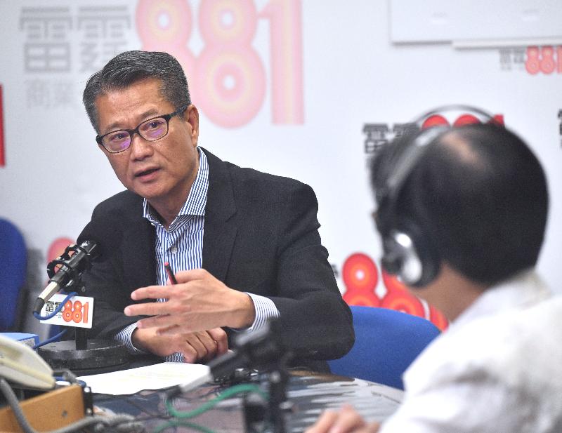 The Financial Secretary, Mr Paul Chan, attends Commercial Radio's programme "Saturday Forum" this morning (May 18).