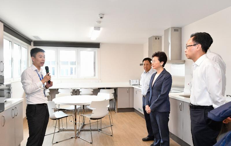 The Chief Executive, Mrs Carrie Lam, visited CIMC Modular Building Systems plant in Jiangmen today (May 18). Photo shows Mrs Lam (second right) touring the student common area in the display centre. Accompanying her is the Secretary for Constitutional and Mainland Affairs, Mr Patrick Nip (first right).