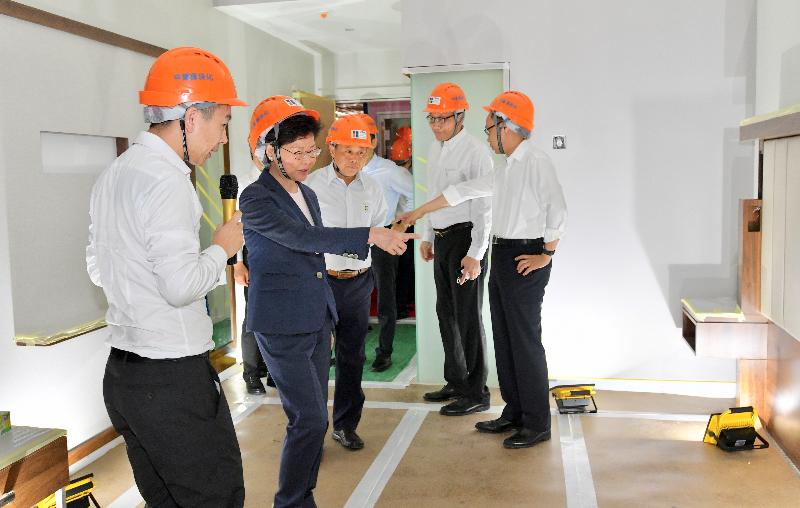 The Chief Executive, Mrs Carrie Lam (second left), visits CIMC Modular Building Systems plant in Jiangmen today (May 18).