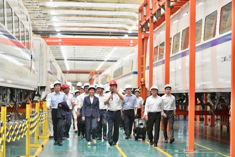 The Chief Executive, Mrs Carrie Lam (front row, second left), tours the CRRC Guangdong depot in Jiangmen today (May 18).