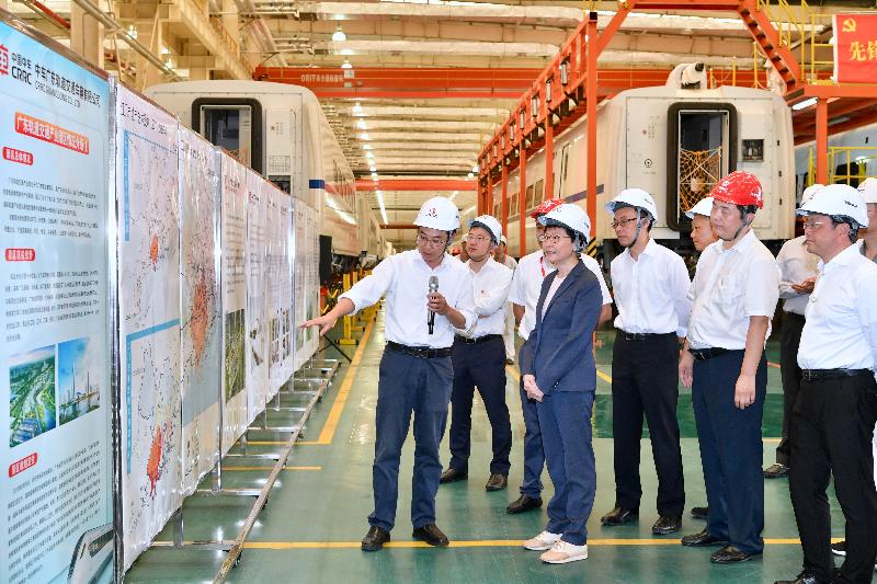 The Chief Executive, Mrs Carrie Lam, tours the CRRC Guangdong depot in Jiangmen today (May 18). Photo shows Mrs Lam (fourth right); the Mayor of the Jiangmen Municipal Government, Mr Liu Yi (first right); and the Secretary for Constitutional and Mainland Affairs, Mr Patrick Nip (third right), receiving a briefing from a representative of the company on its operation.

