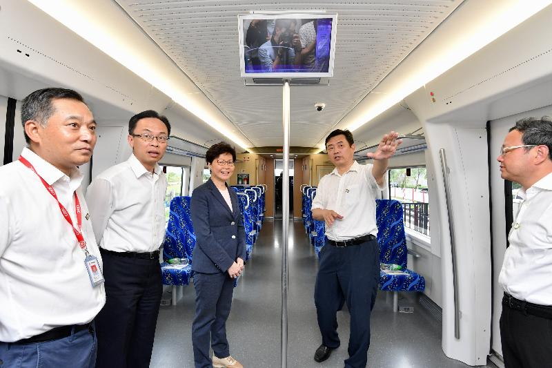 The Chief Executive, Mrs Carrie Lam, toured the CRRC Guangdong depot in Jiangmen today (May 18). Photo shows Mrs Lam (centre), accompanied by the Mayor of the Jiangmen Municipal Government, Mr Liu Yi (first right); and the Secretary for Constitutional and Mainland Affairs, Mr Patrick Nip (second left), viewing a train compartment.