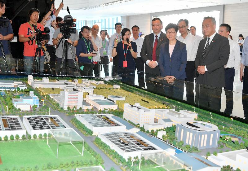 The Chief Executive, Mrs Carrie Lam (front row, second right), tours the Lee Kum Kee Group production base in Xinhui, Jiangmen today (May 18) to learn more about the business development and operation of the enterprise. Accompanying her is the Secretary for Constitutional and Mainland Affairs, Mr Patrick Nip (back row, second right).