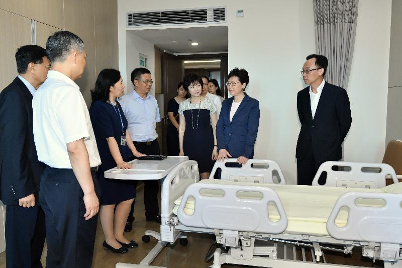 The Chief Executive, Mrs Carrie Lam, visited the Clifford Hospital in Guangzhou today (May 18). Photo shows Mrs Lam (second right) and the Secretary for Constitutional and Mainland Affairs, Mr Patrick Nip (first right) touring a medical ward.
