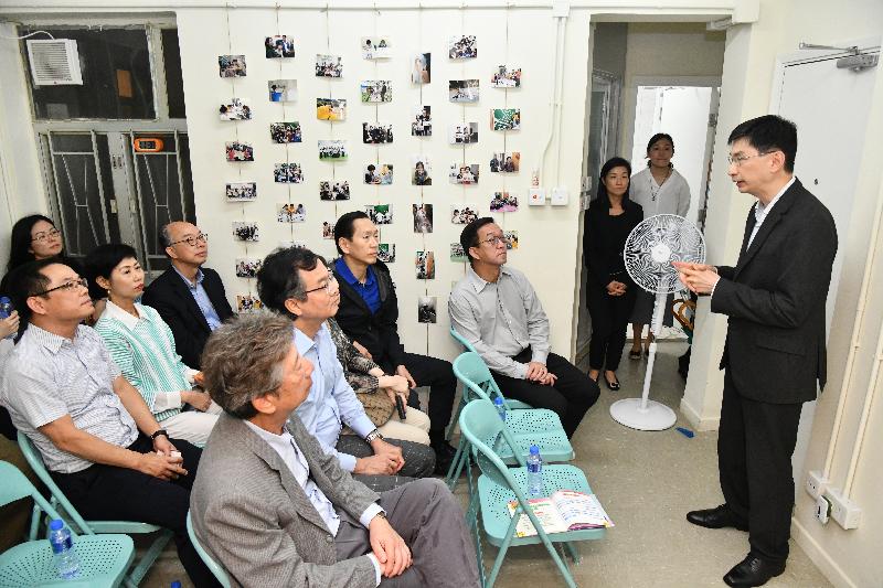 Non-official Members of the Executive Council (ExCo Members) today (May 27) visited the Sham Tseng Light Housing and transitional housing units under the Hong Kong Council of Social Service's Community Housing Movement. Photo shows ExCo Members and the Secretary for Transport and Housing, Mr Frank Chan Fan (third row, first right), being briefed about the transitional housing project Good Homes under the Community Housing Movement.