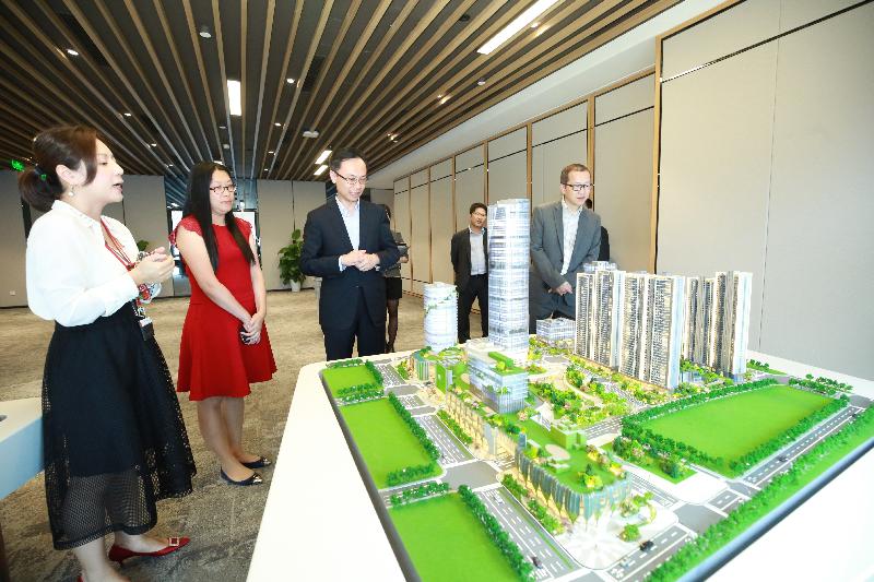 The Secretary for Constitutional and Mainland Affairs, Mr Patrick Nip (third left), visits a development project undertaken by a Hong Kong enterprise during his visit to Guangzhou today (May 28) to keep abreast of the business situation of Hong Kong companies in the municipality. 