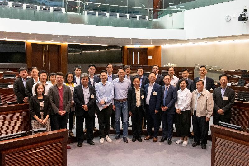 Members of the Legislative Council (LegCo) and the Tuen Mun District Council are pictured after the meeting held in the LegCo Complex today (June 4).