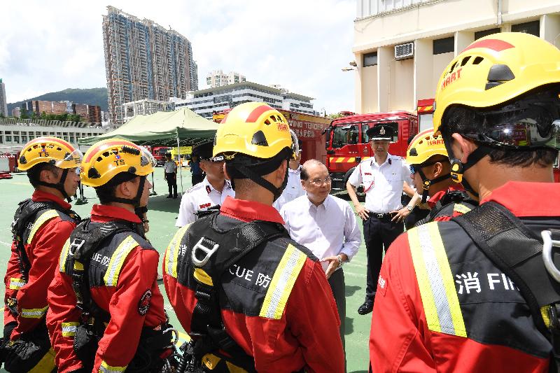 The Chief Secretary for Administration, Mr Matthew Cheung Kin-chung, visited Sha Tin Fire Station this afternoon (June 8). Photo shows Mr Cheung (fourth right) being briefed on the services of the High Angle Rescue Team of the Fire Services Department.