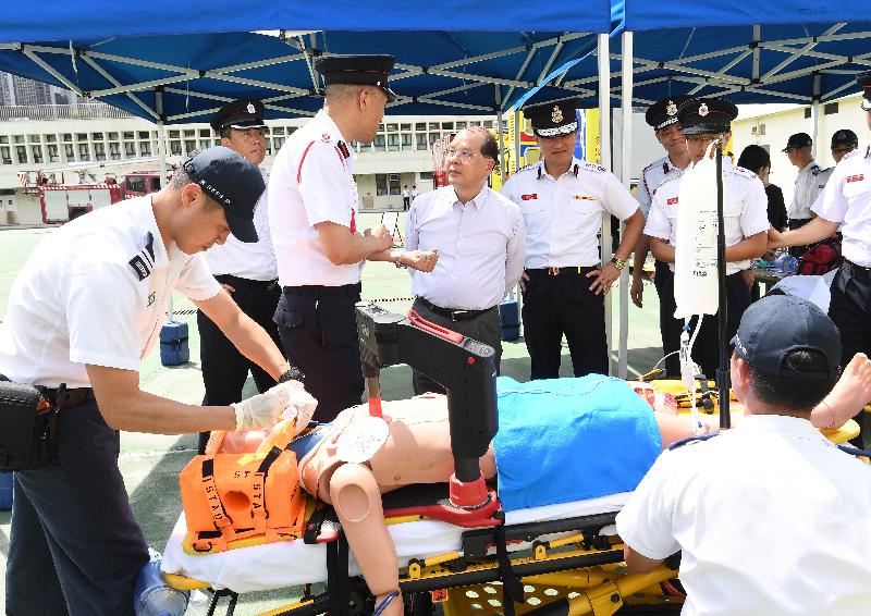 The Chief Secretary for Administration, Mr Matthew Cheung Kin-chung , visited Sha Tin Fire Station this afternoon (June 8). Photo shows Mr Cheung (back row, third left) inspecting the operation of emergency ambulance services and viewing a demonstration of different ambulance equipment. Also present is the Director of Fire Services, Mr Li Kin-yat (back row, fourth left).