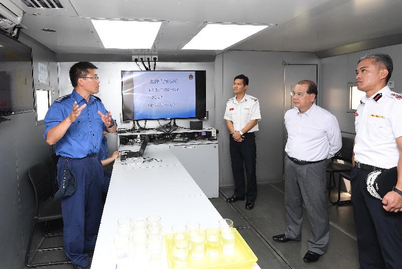 The Chief Secretary for Administration, Mr Matthew Cheung Kin-chung , visited Sha Tin Fire Station this afternoon (June 8). Photo shows Mr Cheung (second first), accompanied by the Director of Fire Services, Mr Li Kin-yat (second right), visiting a Mobile Command Unit and being briefed by the members of the Mobilizing and Communications Group.