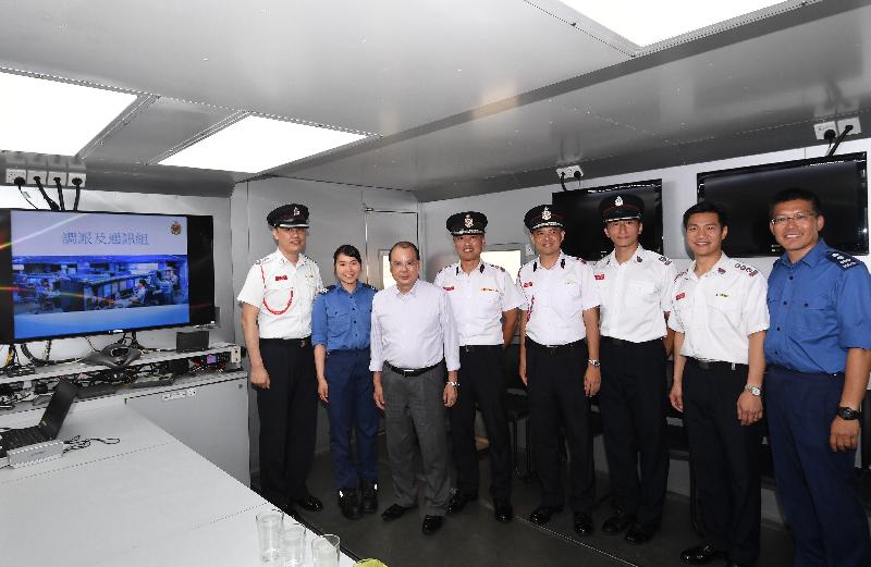The Chief Secretary for Administration, Mr Matthew Cheung Kin-chung , visited Sha Tin Fire Station this afternoon (June 8). Photo shows Mr Cheung (third left); the Director of Fire Services, Mr Li Kin-yat (fourth left); and the members of the Mobilizing and Communications Group of the Fire Services Department on the Mobile Command Unit.