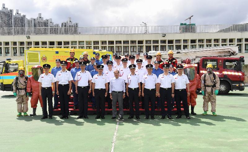 The Chief Secretary for Administration, Mr Matthew Cheung Kin-chung, visited Sha Tin Fire Station this afternoon (June 8). Photo shows Mr Cheung (front row, centre); the Director of Fire Services, Mr Li Kin-yat (front row, fourth left); and fire and ambulance personnel.