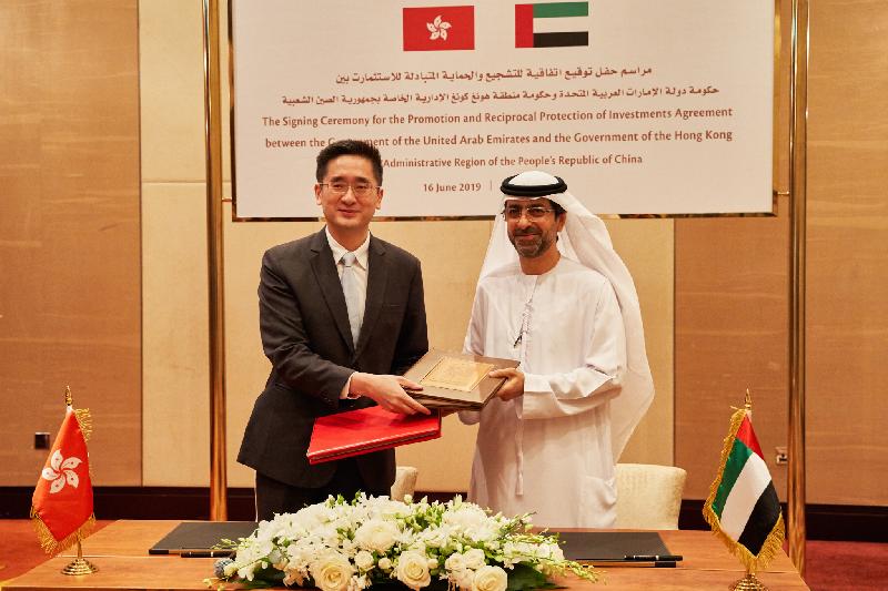 The Under Secretary for Commerce and Economic Development, Dr Bernard Chan (left), and the Under Secretary of the Ministry of Finance of the United Arab Emirates (UAE), Mr Younis Haji Al Khoori (right), signed the Hong Kong-UAE Investment Promotion and Protection Agreement (IPPA) in Dubai, the UAE today (June 16, Dubai time). Photo shows Dr Chan exchanging the IPPA documents with Mr Al Khoori after the signing ceremony.