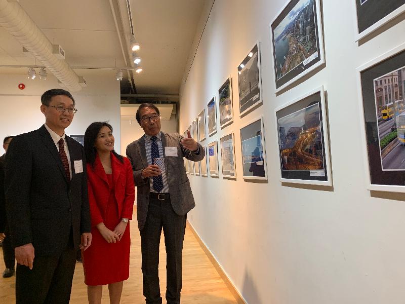 The Director of the Hong Kong Economic and Trade Office (Toronto), Ms Emily Mo (centre); the Consul General of the People's Republic of China in Toronto, Mr Han Tao (left); and Honorary Advisor of the Chinese Canadian Photographic Society of Toronto Mr Stephen Siu (right) tour the photo exhibition at the opening ceremony of Hong Kong Week and the "Connect & Excel - Past, Present & Future" photo exhibition held at the Dr Hin-Shiu Hung Art Gallery of the Chinese Cultural Centre of Greater Toronto yesterday  (June 18, Toronto time).
