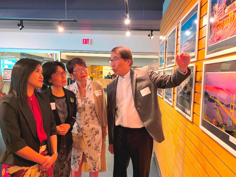 From left: the Director of the Hong Kong Economic and Trade Office (Toronto), Ms Emily Mo; the Consul General of the People's Republic of China in Vancouver, Ms Tong Xiaoling; Member of the Legislative Assembly of British Columbia Ms Teresa Wat; and the Honorary Advisor of the Chinese Canadian Photographic Society of Toronto, Mr Stephen Siu, tour the "Connect & Excel - Past, Present & Future" photo exhibition at the Sunroom and Gallery of Robson Square at the University of British Columbia in Vancouver yesterday (June 24, Vancouver time).