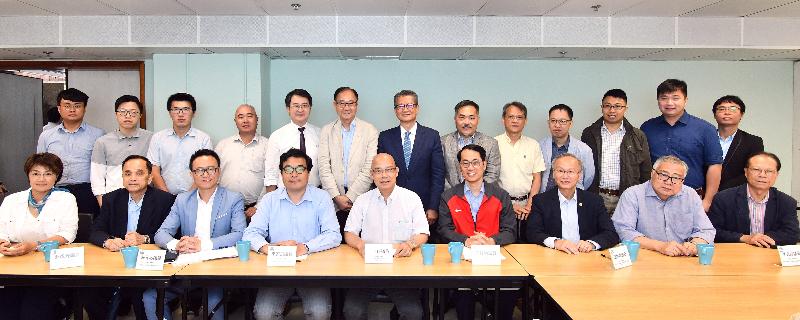 The Financial Secretary, Mr Paul Chan, visited Sai Kung District Council (SKDC) this afternoon (June 25). Mr Chan (back row, centre) and the District Officer (Sai Kung), Mr David Chiu (back row, sixth right), are pictured with the Chairman of the SKDC, Mr George Ng (back row, sixth left), and members of the SKDC.