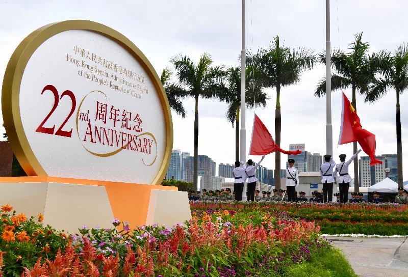 The raising of the National and Regional flags at the flag-raising ceremony for the 22nd anniversary of the establishment of the Hong Kong Special Administrative Region at Golden Bauhinia Square in Wan Chai this morning (July 1).