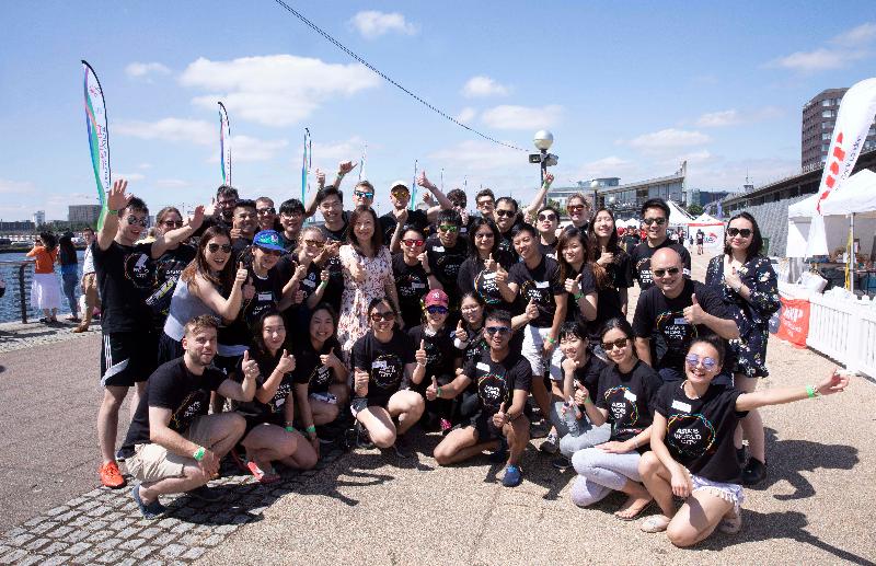 The Director-General of the Hong Kong Economic and Trade Office, London (London ETO), Ms Priscilla To (second row, fourth left), with the London ETO team at the London Hong Kong Dragon Boat Festival 2019 on June 30  (London time).
