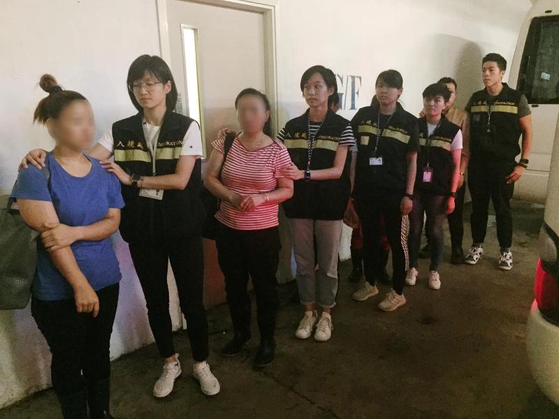 The Immigration Department mounted an anti-illegal worker operation codenamed "Twilight" on July 2 and 3 in Kowloon. Photo shows illegal workers arrested during the operation.