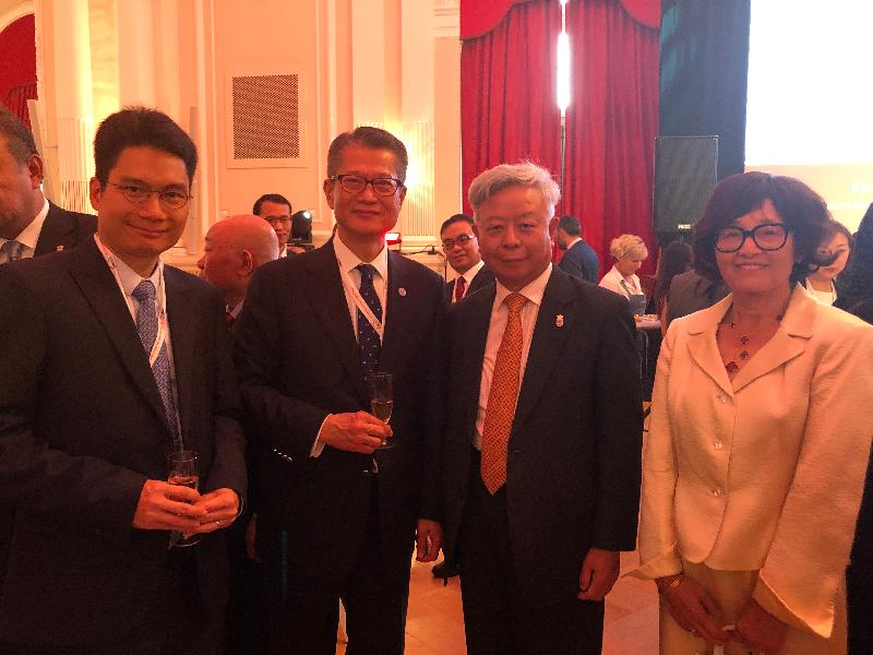 The Financial Secretary, Mr Paul Chan, yesterday (July 11, Luxembourg time) attended a reception of the Asian Infrastructure Investment Bank in Luxembourg. Photo shows (from left) the Under Secretary for Financial Services and the Treasury, Mr Joseph Chan; Mr Chan; the President of the Asian Infrastructure Investment Bank, Mr Jin Liqun; and Mrs Jin. 