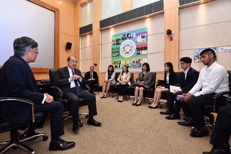 The Chief Secretary for Administration, Mr Matthew Cheung Kin-chung, visited the Hong Kong Observatory (HKO) today (July 15). Joining him were four participants of the "Be a Government Official for a Day" programme. Photo shows Mr Cheung (second left) and the Director of the HKO, Mr Shun Chi-ming (first left), speaking with the participants of the programme.