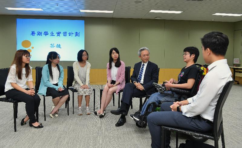 The Secretary for the Civil Service, Mr Joshua Law, today (July 17) met post-secondary students with disabilities participating in a government summer internship scheme at a tea gathering at the Central Government Offices. Photo shows Mr Law (third right) chatting with Executive Officer II and an alumna of the internship scheme, Miss Jennifer Shum (fourth left), three of the interns, Miss Priscilla Pang (second left), Miss Maggie Cheng (third left) and Miss Apple Fan (second right), as well as their mentors to learn about their internship experience.