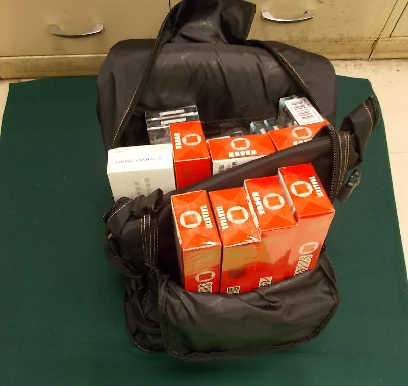 Hong Kong Customs yesterday (July 17) detected two illicit cigarettes cases involving wheelchairs and seized about 15 000 suspected illicit cigarettes with an estimated market value of about $40,000 and a duty potential of about $28,000 at Lo Wu Control Point. Photo shows some of the seized suspected illicit cigarettes.