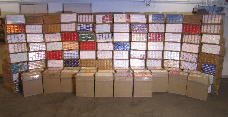 Hong Kong Customs seized about 1.2 million suspected illicit cigarettes with an estimated market value of about $3.2 million and a duty potential of about $2.7 million at Man Kam To Control Point yesterday (July 18).