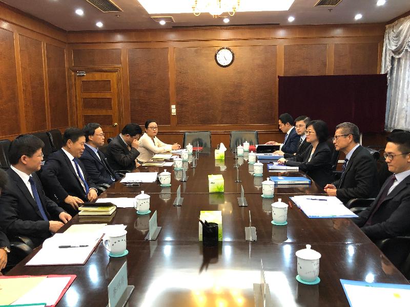 The Financial Secretary, Mr Paul Chan (second right), today (July 19) meets with the Commissioner of the State Taxation Administration, Mr Wang Jun (second left), in Beijing to discuss tax matters of mutual interest before the signing of the Fifth Protocol to the Arrangement between the Mainland of China and the Hong Kong Special Administrative Region for the Avoidance of Double Taxation and the Prevention of Fiscal Evasion with respect to Taxes on Income.