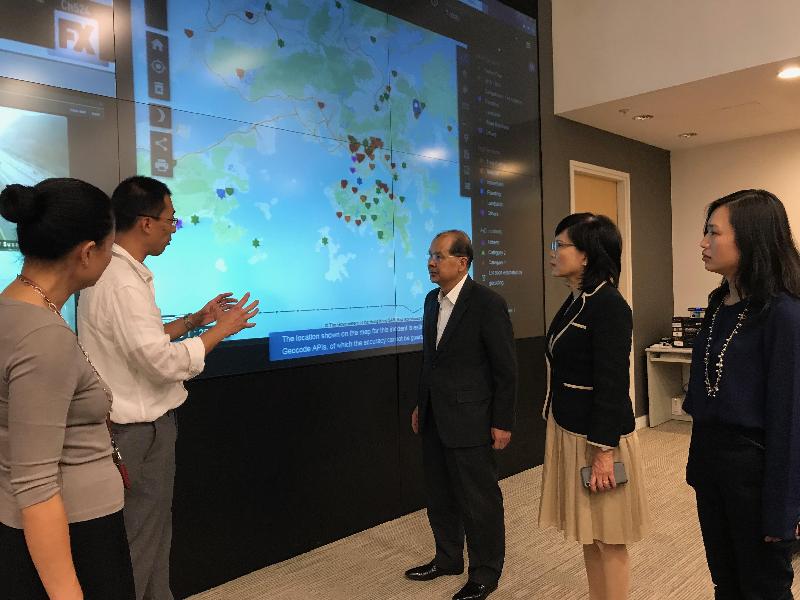 The Chief Secretary for Administration, Mr Matthew Cheung Kin-chung (center), visited the Emergency Monitoring and Support Centre of the Security Bureau and was briefed about the measures that were put in place in response to Tropical Cyclone Wipha's threat today (July 31). Photo shows Mr Cheung being briefed by the Permanent Secretary for Security, Mrs Marion Lai (second right), and duty staff on the works of the Centre.