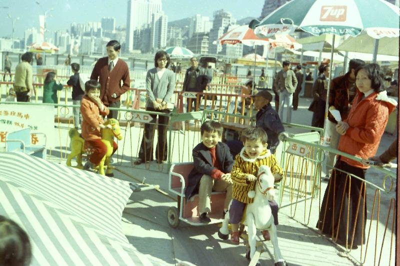 The Public Records Office of the Government Records Service will hold the "Pleasure and Leisure: A Glimpse of Children's Pastimes in Hong Kong" roving exhibition at the Kowloon Public Library from August 2 to 30. Photo shows children enjoying themselves at the Exhibition of Hong Kong Products at new landfills in Wan Chai in the 1970s, courtesy of Mr Chong Hing-fai.