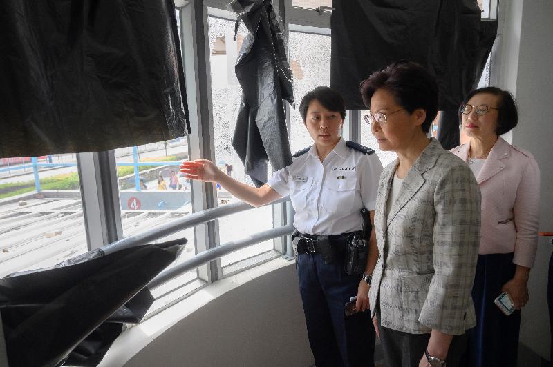 The Chief Executive, Mrs Carrie Lam (centre), accompanied by the Secretary for Food and Health, Professor Sophia Chan (right), visited the Tin Shui Wai Police Station today (August 7) to learn more about the damage to its facilities and meet the police officers of the district.