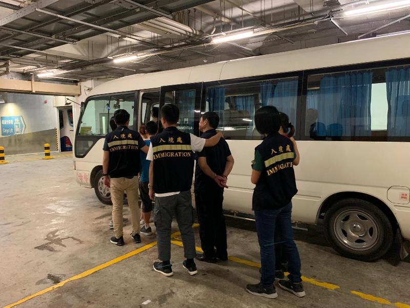 The Immigration Department mounted an anti-illegal worker operation codenamed "Twilight" yesterday (August 12) on Hong Kong Island. Photo shows illegal workers arrested during the operation.