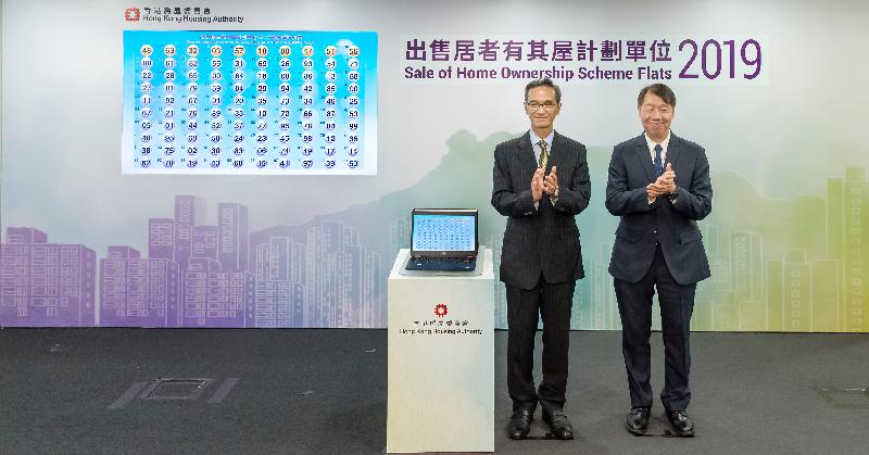 The Chairman of the Subsidised Housing Committee of the Hong Kong Housing Authority (HA), Mr Stanley Wong (left) officiated at the electronic ballot drawing ceremony today (August 15) for the HA's Sale of Home Ownership Scheme Flats 2019 to determine the priority sequence based on the last two digits of the application numbers. Also pictured is the Assistant Director of Housing (Housing Subsidies), Mr Alan Hui.