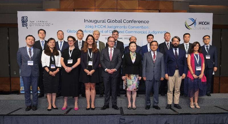The Secretary for Justice, Ms Teresa Cheng, SC (front row, fourth right), is pictured with the Director-General of the Department of Treaty and Law of the Ministry of Foreign Affairs, Mr Jia Guide (front row, third right); the Secretary General of the Hague Conference on Private International Law (HCCH), Dr Christophe Bernasconi (front row, centre); and speakers at the "2019 HCCH Judgments Convention: Global Enforcement of Civil and Commercial Judgments" today (September 9). 