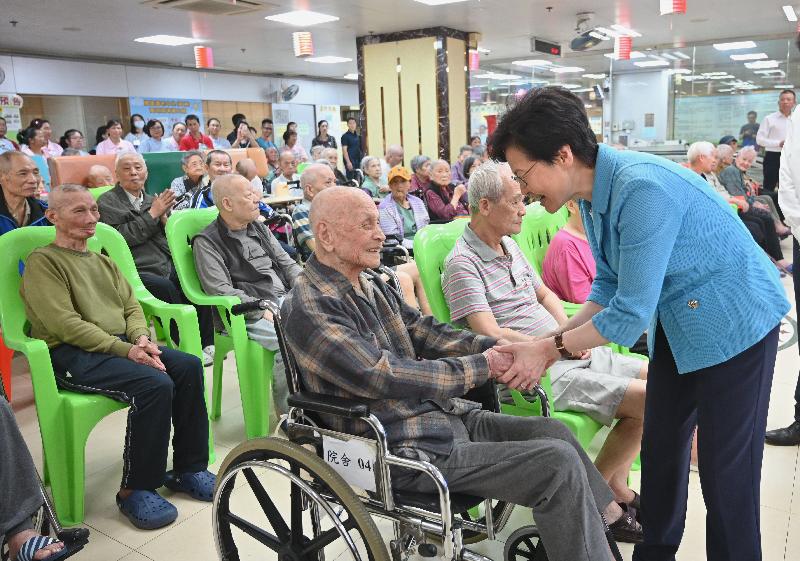 The Chief Executive, Mrs Carrie Lam (first right), visits a residential care home for the elderly in Kwai Chung to extend her Mid-Autumn Festival greetings to the elderly this afternoon (September 13) .