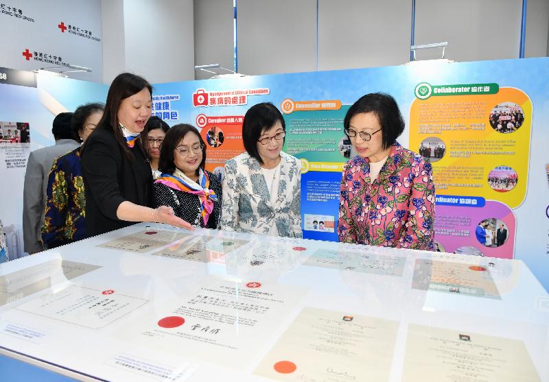 Accompanying by the Director of Health, Dr Constance Chan (second right); and the Principal Nursing Officer of the Department of Health (DH), Dr Mary Foong (second left), the Secretary for Food and Health, Professor Sophia Chan (first right), today (September 21) tours the exhibition at the 65th Anniversary Ceremony of Hong Kong Public Health Nursing and Conference to pay homage to the development of public health nursing in Hong Kong and the work of public health nurses of the DH through the years.