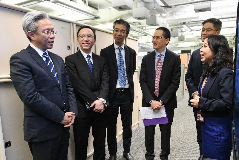 The Secretary for the Civil Service, Mr Joshua Law, visited the Office of the Government Chief Information Officer today (September 24). Photo shows Mr Law (first left) being briefed by colleagues on their work. Looking on is the Government Chief Information Officer, Mr Victor Lam (second left).