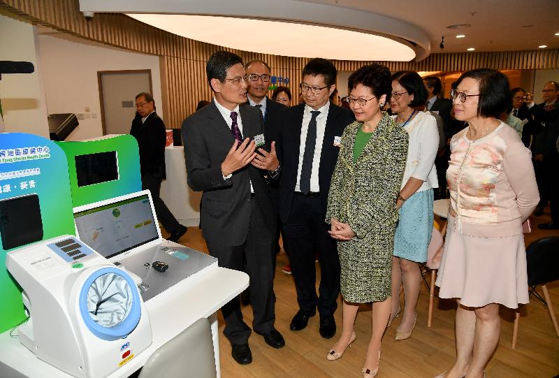 The Chief Executive, Mrs Carrie Lam (third right), accompanied by the Secretary for Food and Health, Professor Sophia Chan (first right), tours around the Kwai Tsing District Health Centre to learn more about its facilities and services after officiating at the opening ceremony today (September 24). Photo shows Mrs Lam visiting the health station in the centre.