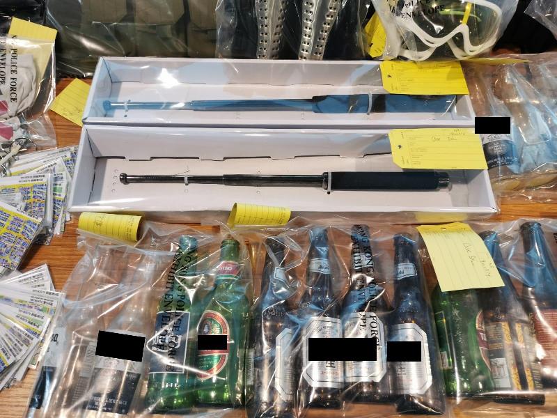 Police seized a large amount of offensive weapons .