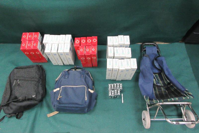 Hong Kong Customs mounted a special operation codenamed "Chameleon" in September at land boundary, rail and ferry control points to strengthen enforcement against smuggling activities making use of children. Photo shows some of the suspected duty-not-paid cigarettes seized.