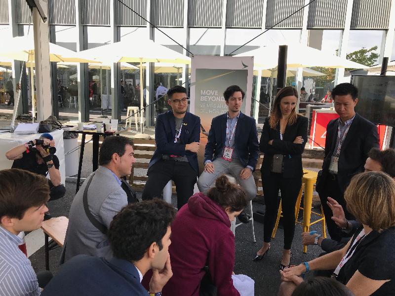 Deputy Representative of of Hong Kong Economic and Trade Office, Brussels, Mr Sam Hui (first right) briefs South Summit visitors on the opportunities in Hong Kong for European start-ups at the "Hong Kong Corner" in Madrid, Spain on October 3 (Madrid time).