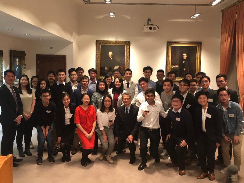 The Financial Secretary, Mr Paul Chan, attended a reception with awardees under the Hong Kong Scholarship for Excellence Scheme who are studying in the UK on October 25 (London time). Photo shows Mr Chan (front row, fifth right); the Special Representative for Hong Kong Economic and Trade Affairs to the European Union, Mr Eddie Cheung (second row, first left); and the Director-General of the Hong Kong Economic and Trade Office, London, Miss Winky So (front row, seventh right), in a group photo with the students at the reception.