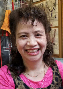 60-year-old Wu Ho-ching is about 1.52 metres tall, 50 kilograms in weight and of middle build. She has a round face with yellow complexion and long curly dark brown hair. 
