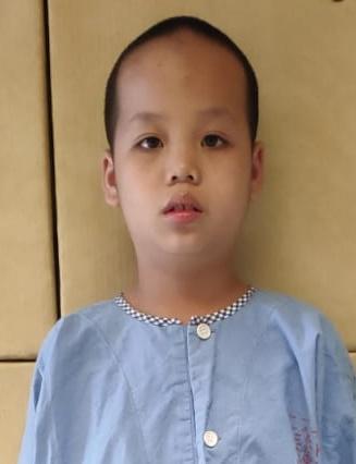 The boy is about seven years old. He is about 1.2 metres tall and of thin build. He has a round face with yellow complexion and short black hair. He wore a white long-sleeved shirt and black trousers. No identity document was found.