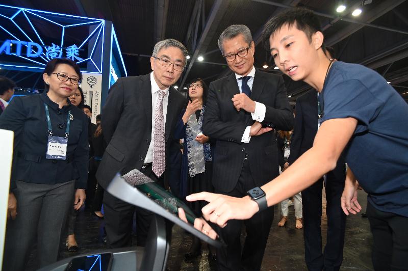 The Financial Secretary, Mr Paul Chan, attended the opening of Hong Kong Fintech Week 2019 this morning (November 6). Photo shows Mr Chan (second right) and the Secretary for Financial Services and the Treasury, Mr James Lau (second left), touring the Hong Kong Science and Technology Parks Corporation Pavilion at the exhibition.